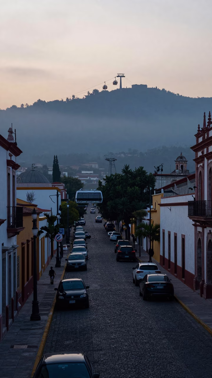 Early Morning Oaxaca Street Scene with Aerial Tramway and Local Commerce in in Oaxaca, Mexico