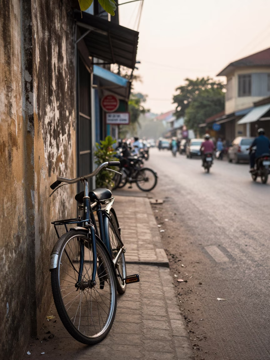 Early Morning Phnom Penh Street Scene with Vintage Bicycle and Rusty Wall Details in in Phnom Penh, Cambodia