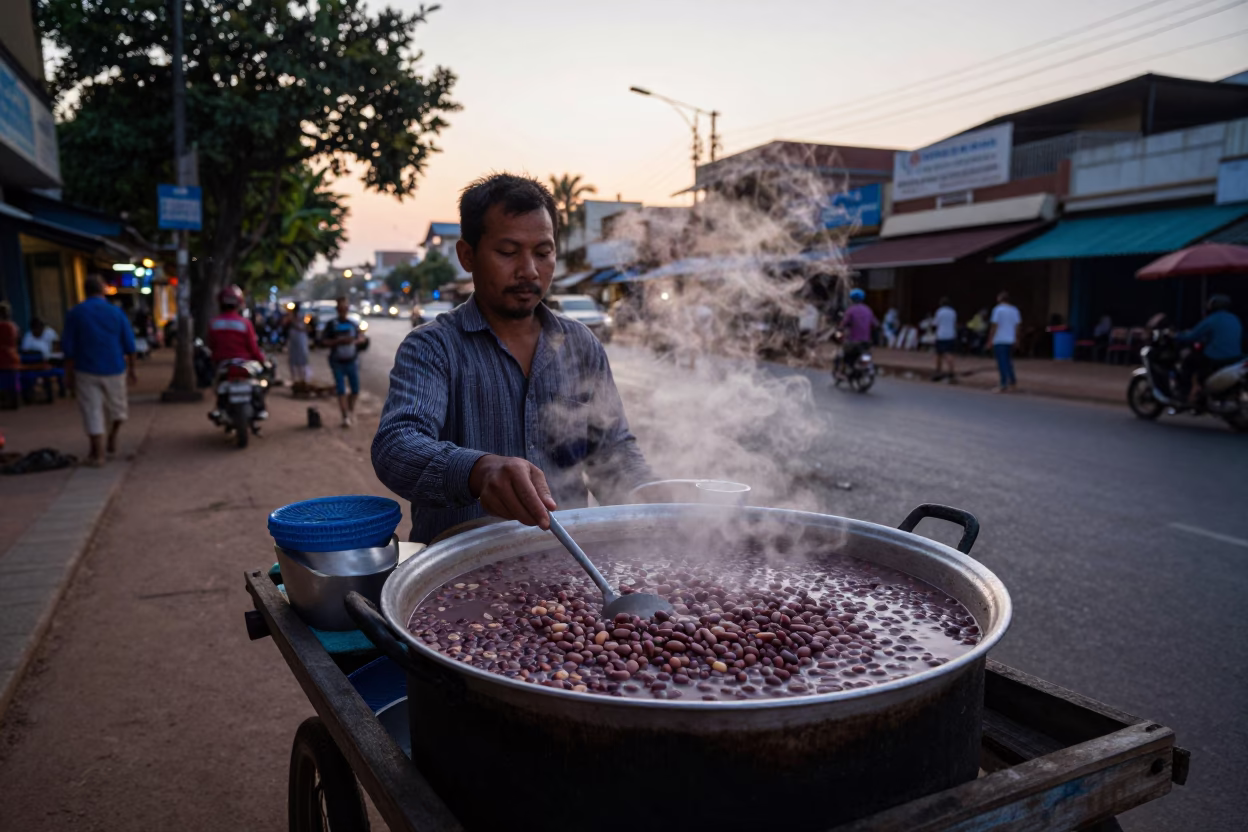 Early Morning Phnom Penh Street Vendor Selling Fasolia Bean Stew Before Dawn in in Phnom Penh, Cambodia