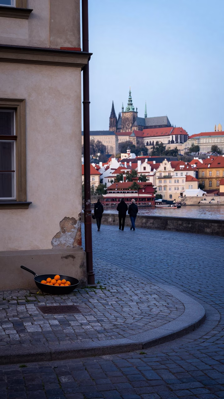 Early Morning Prague Street Scene with Skillet and Oranges on Cobblestone in in Prague, Czech Republic