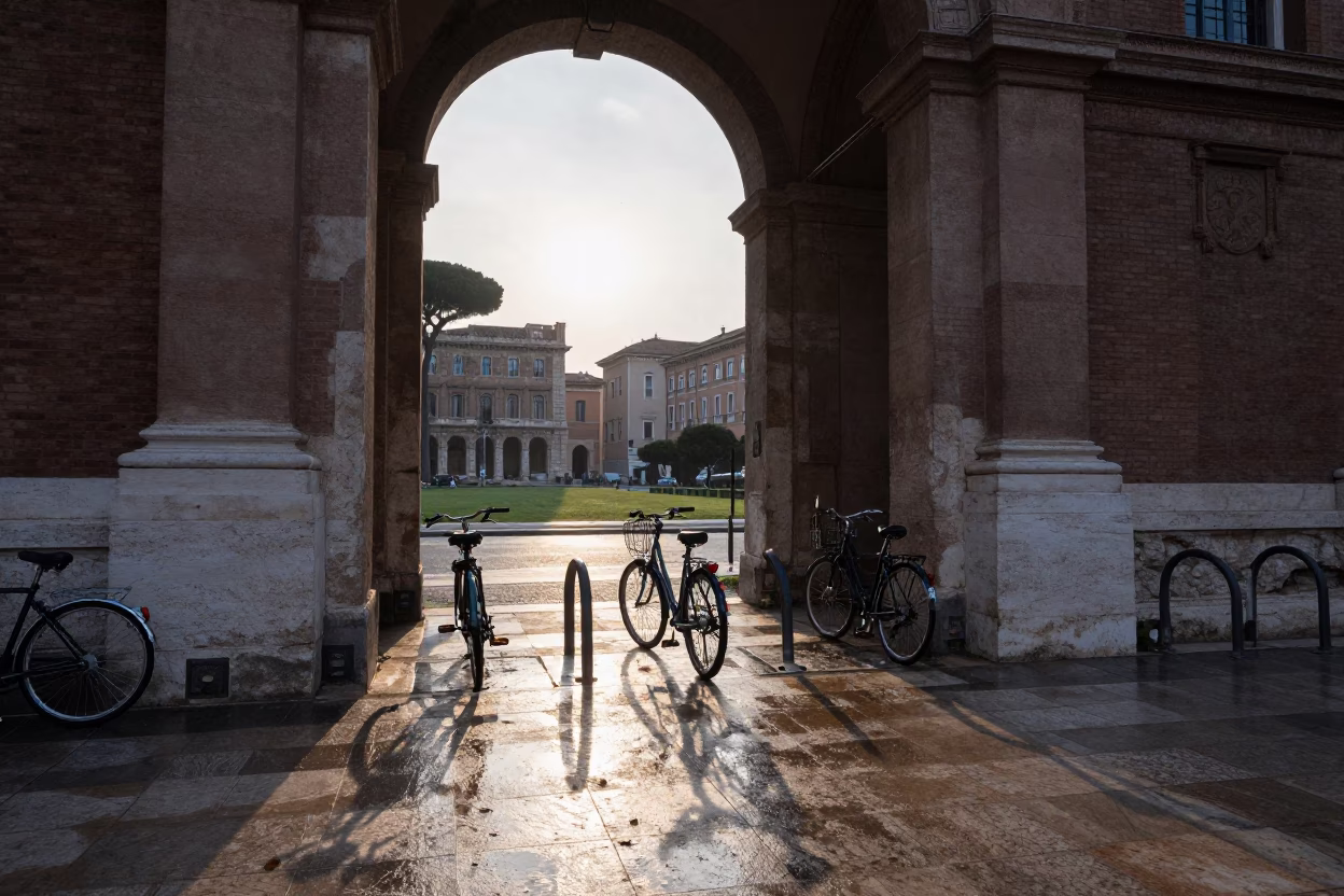 Early Morning Rome Italy University Archway Wet Bicycle Rack and Leaf Shadows Before Dawn in in Rome, Italy