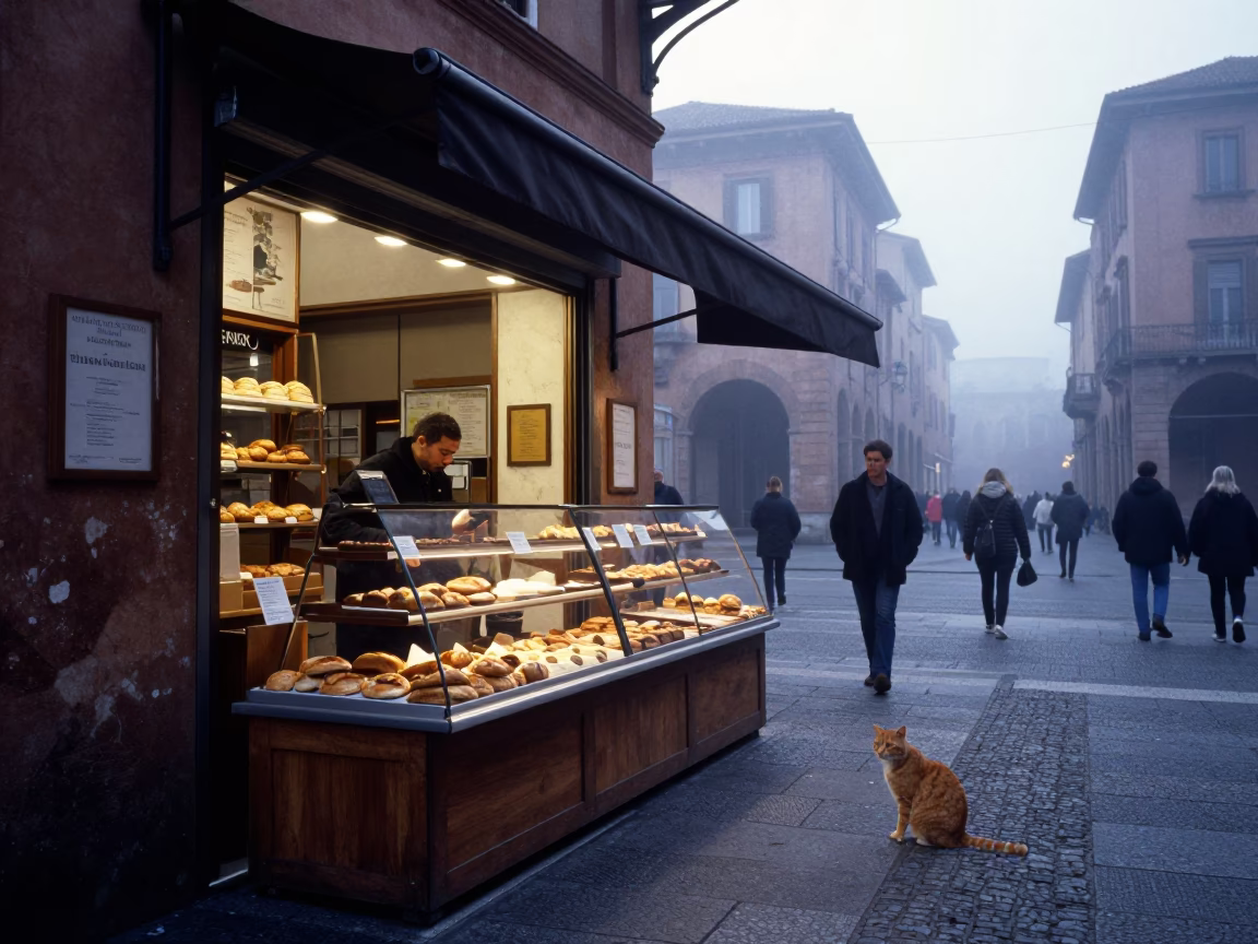 Early morning street scene in Bologna Italy with local bakery display in in Bologna, Italy