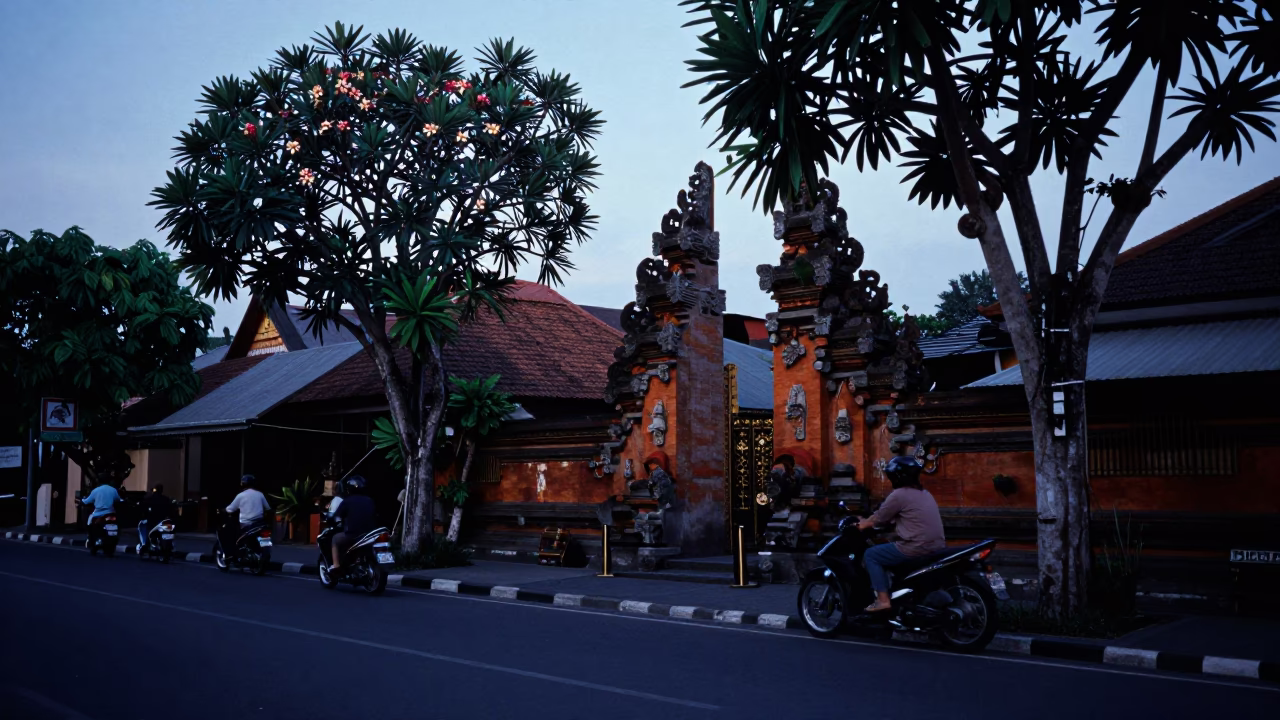 Early Morning Street Scene in Denpasar Indonesia with Motorcycles and Temple Details in in Denpasar, Indonesia