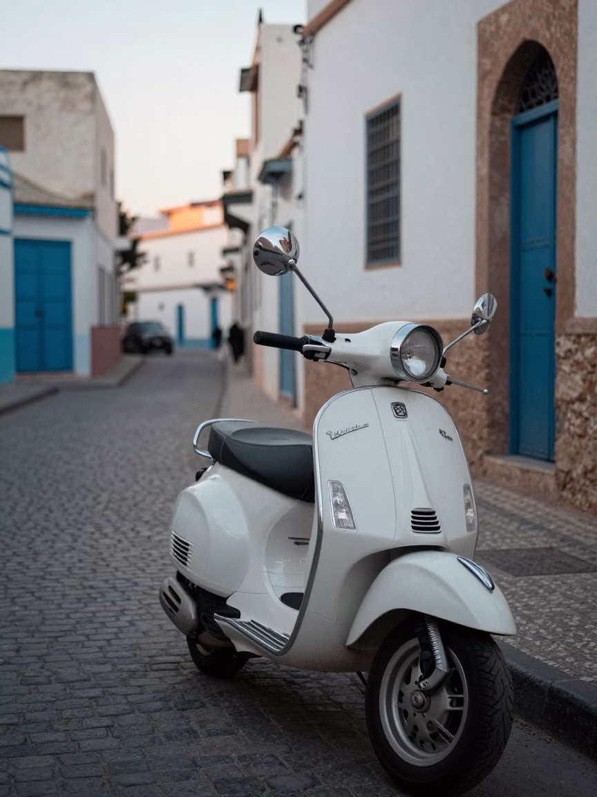 Early Morning Street Scene in Essaouira Morocco with Vintage Vespa and Ceramic Tiles in in Essaouira, Morocco