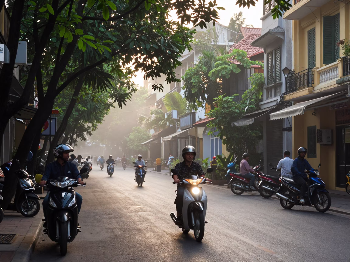 Early Morning Street Scene in Hanoi Vietnam with Scooters and Local Tea Stains in in Hanoi, Vietnam
