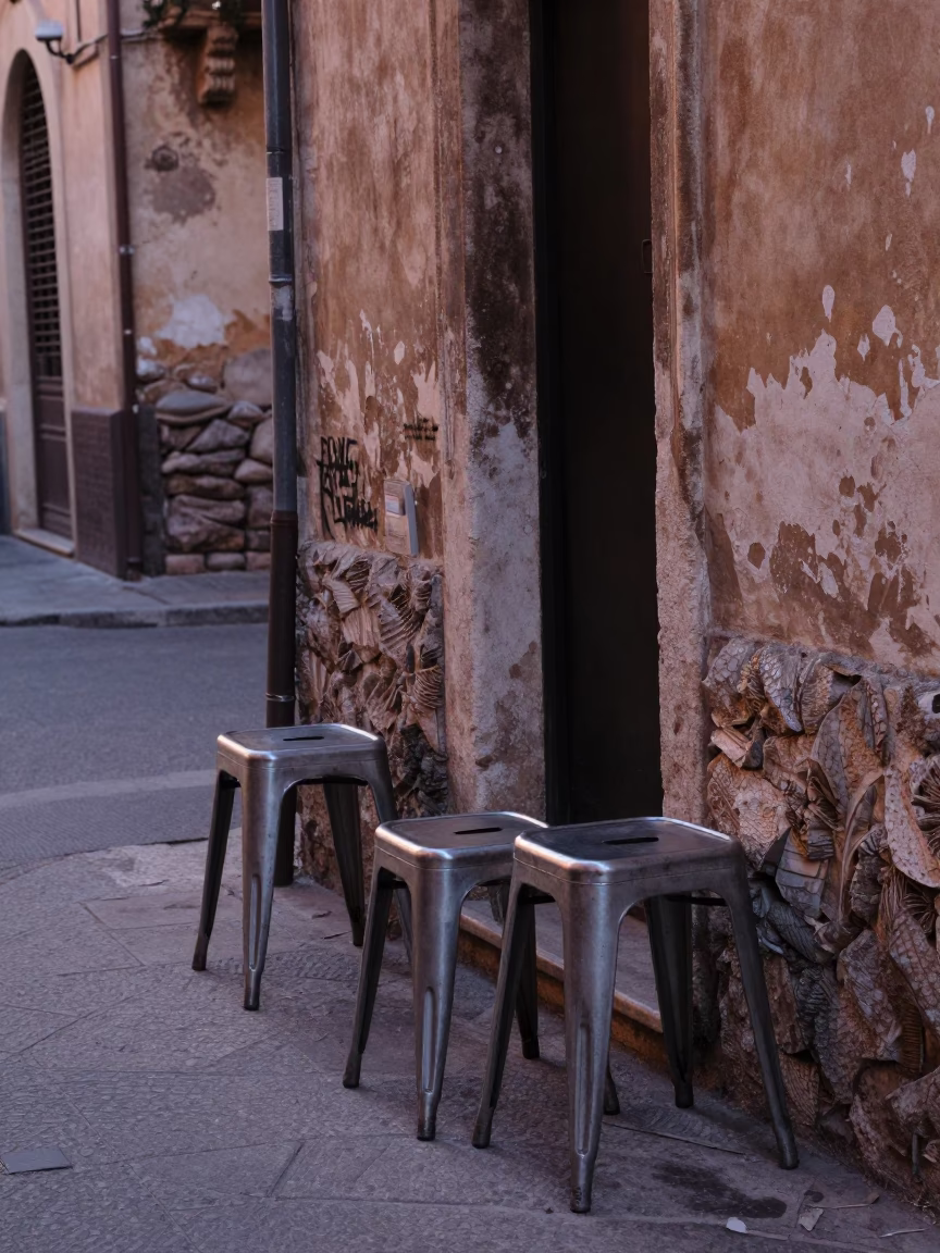 Early Morning Street Scene in Palermo Italy with Metal Stools and Nectarines in in Palermo, Italy