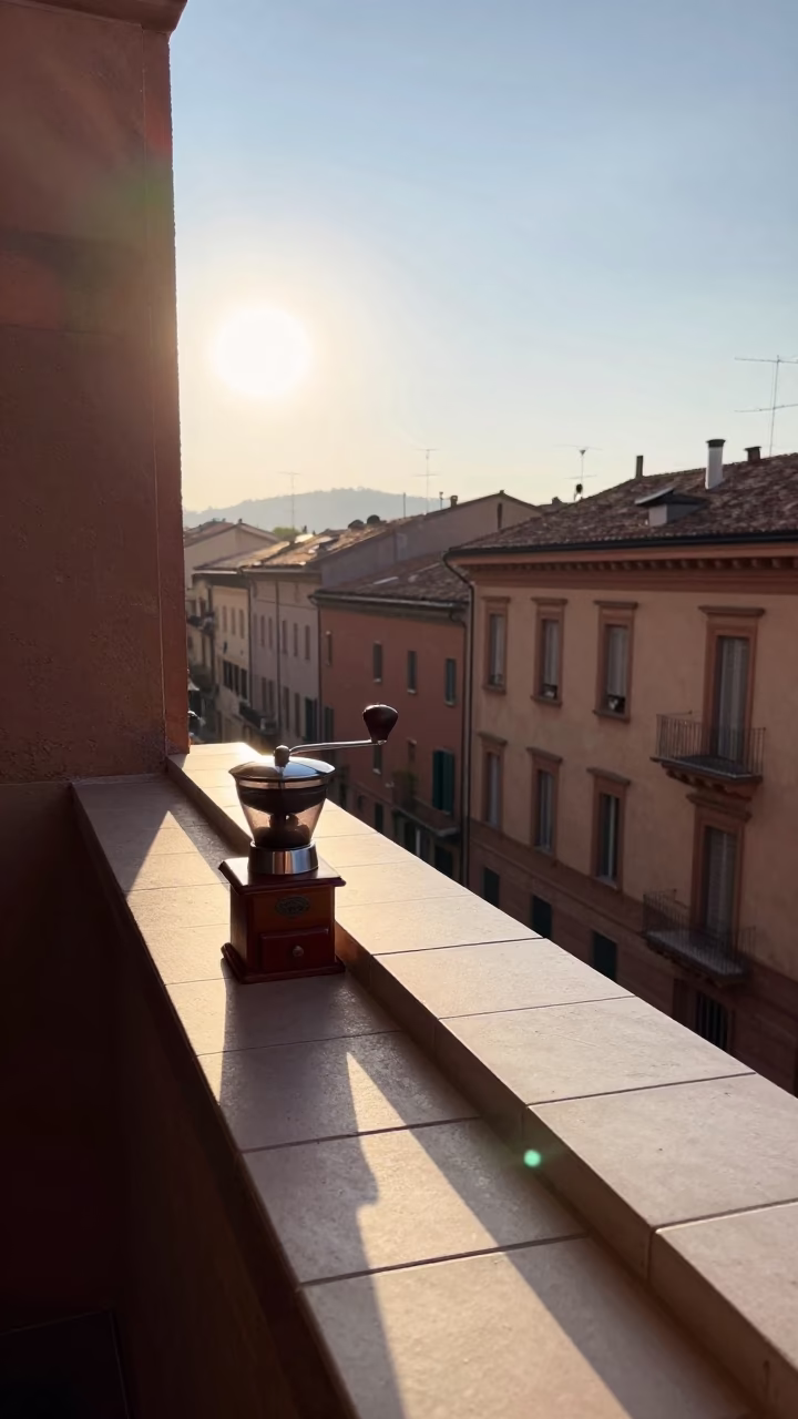 Early Morning Sunlight on Bologna Balcony with Coffee Grinder and Wall Hook in in Bologna, Italy