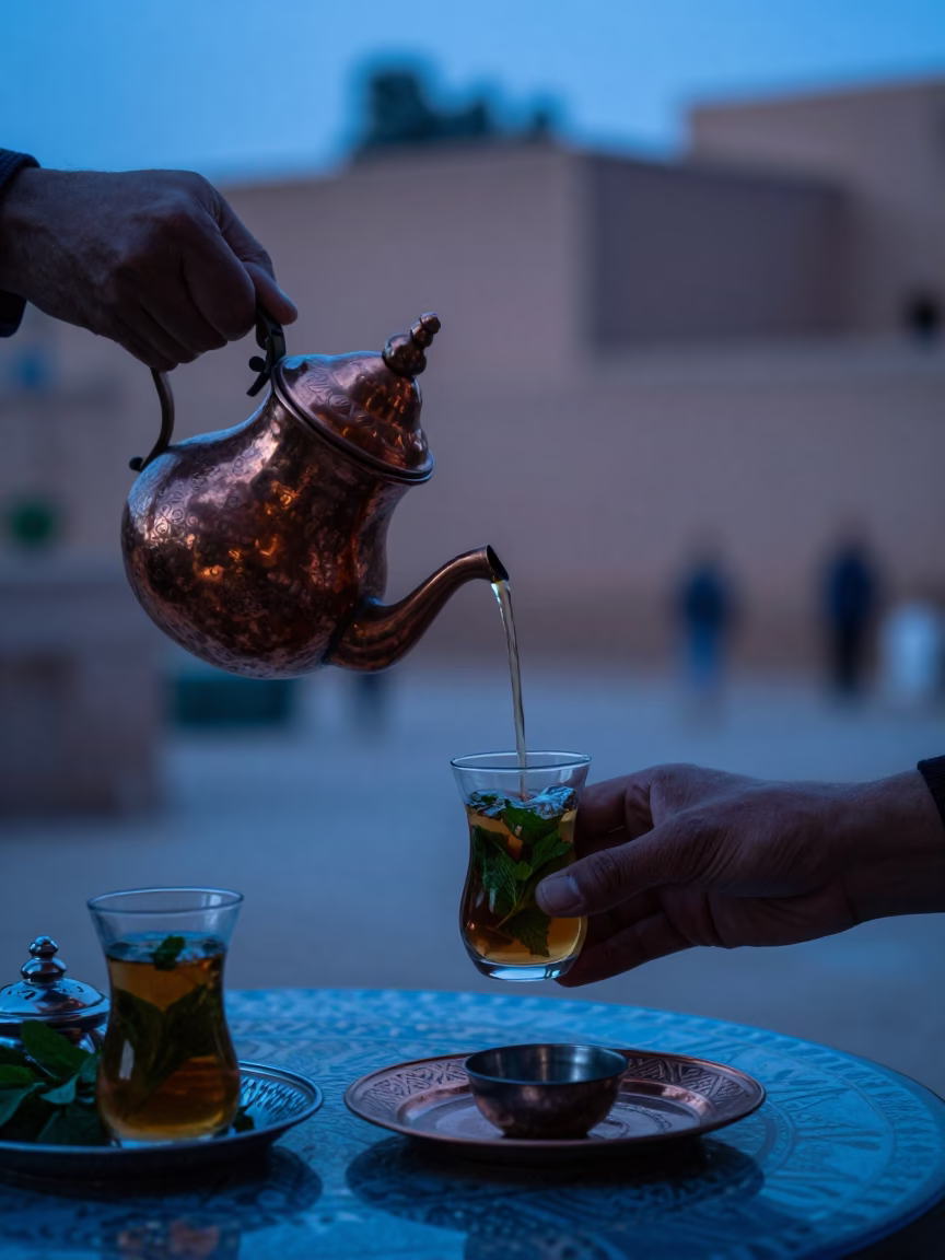 Early Morning Tea Service at a Traditional Marrakech Riad Courtyard Before Sunrise in in Marrakech, Morocco