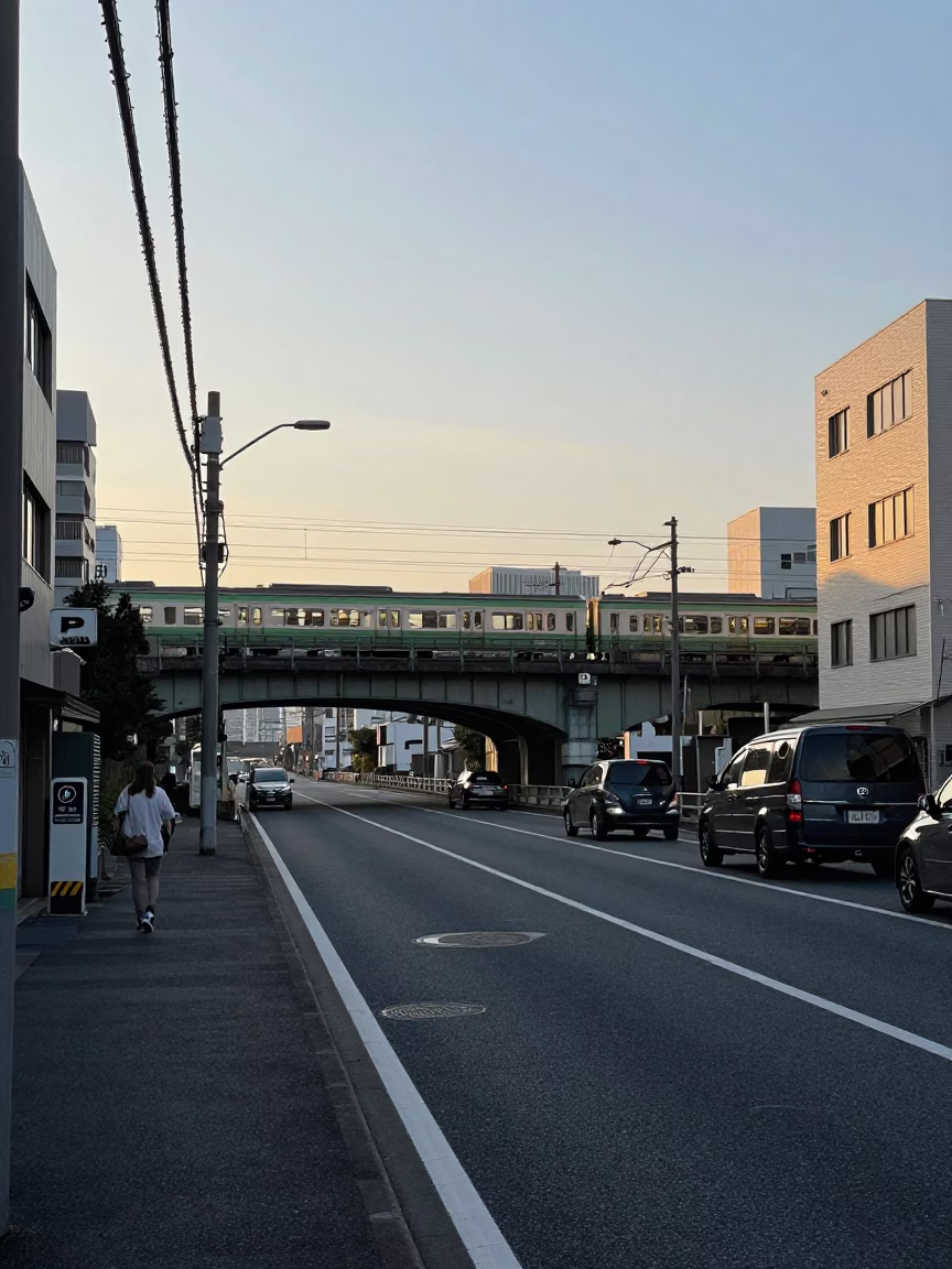 Early Morning Tokyo Street Scene with Railway Viaduct and Art Deco Cinema Facade in in Tokyo, Japan
