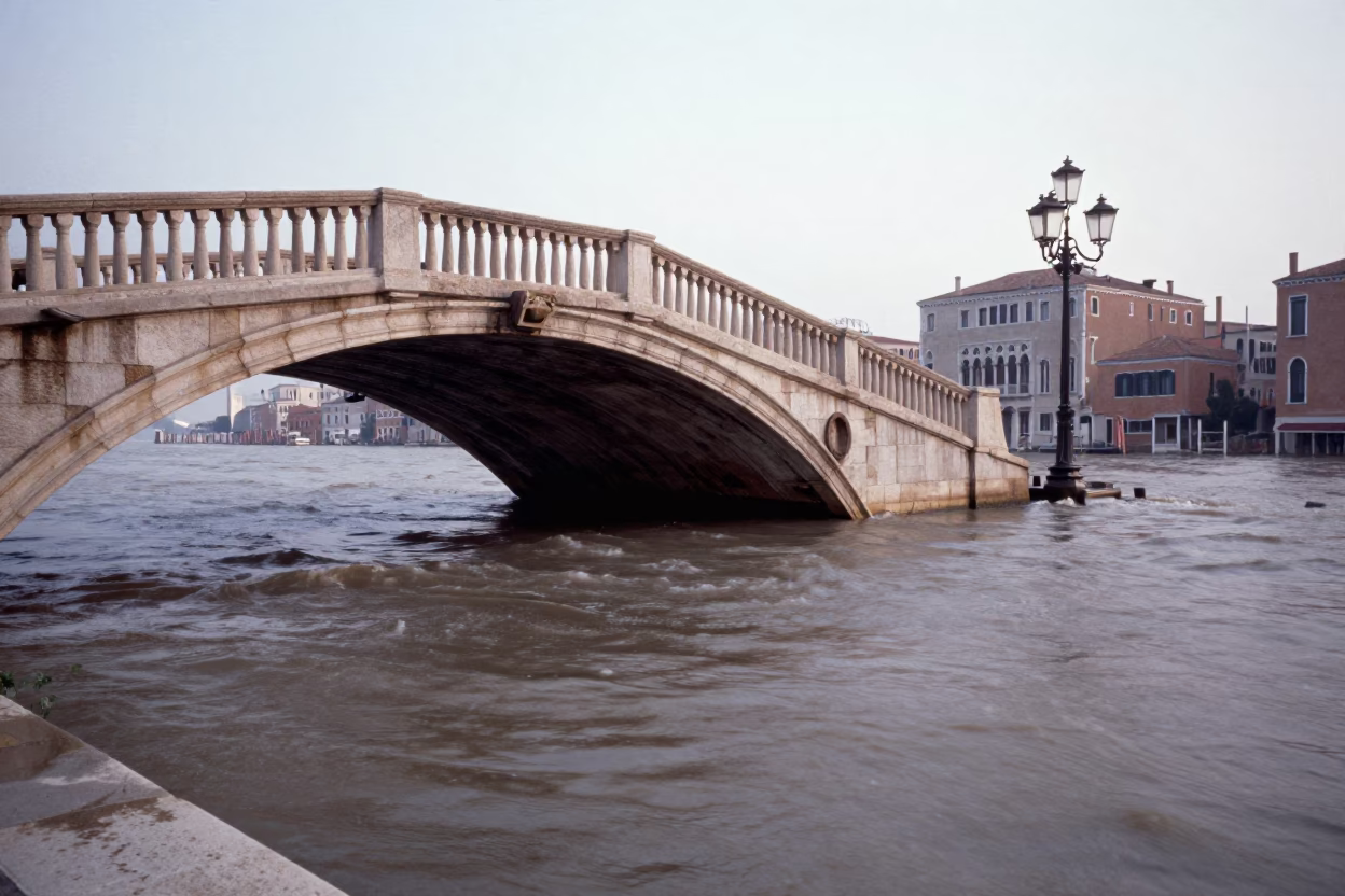 Early Morning Venice Bridge Pier Cutwater Splitting Flood-Brown Current in Lagoon in in Venice, Italy