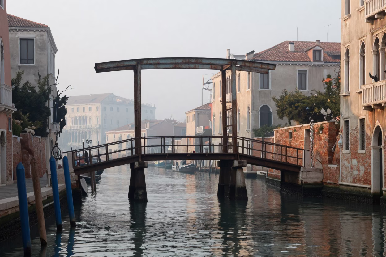 Early Morning Venice Canal Scene with Rusted Drawbridge and Misty Water in in Venice, Italy