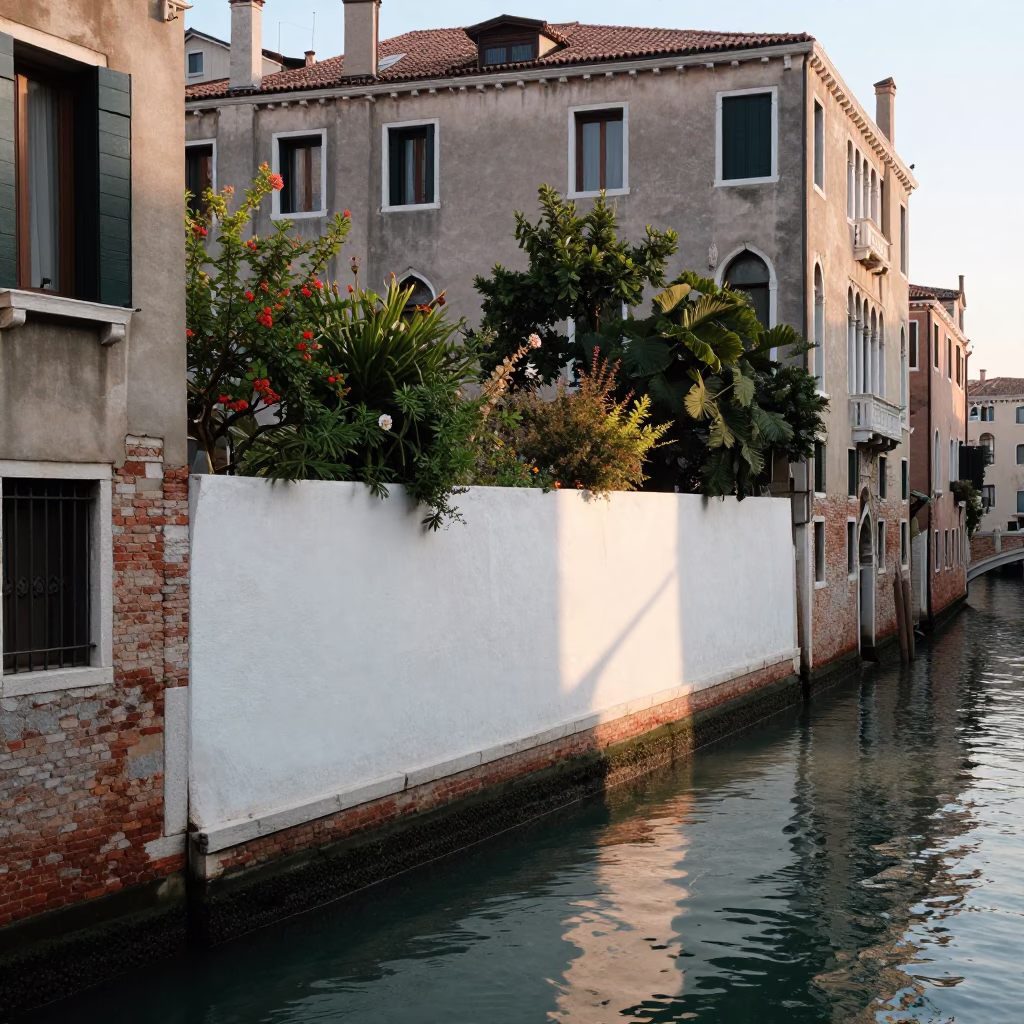Early Morning Venice Canal Scene with White Garden Wall and Bougainvillea in in Venice, Italy