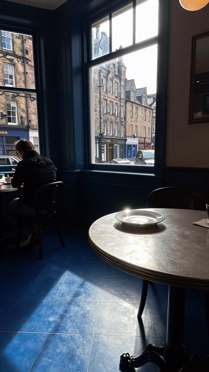 Edinburgh Cafe Interior Sunlight on Tile Floor with Blue Porcelain Bowl and Pepper Mill in in Edinburgh, United Kingdom