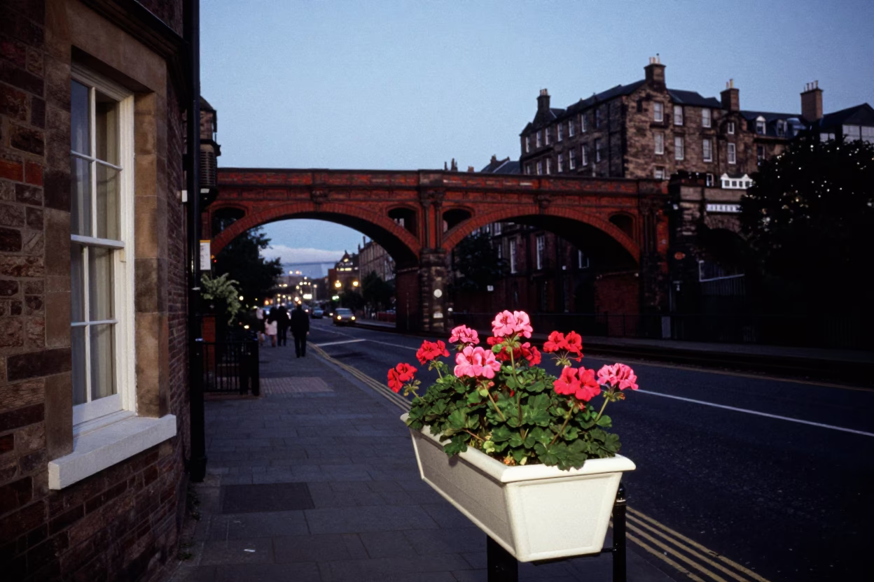 Edinburgh Evening Viaduct Railway Scene with Window Box and Bicycle Basket in Blue Light in in Edinburgh, United Kingdom