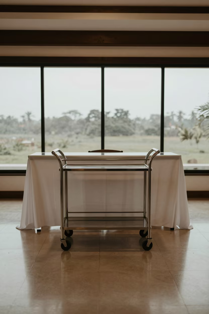 Empty Turn-Down Cart at Dawn Reception Desk Pucallpa in at a reception desk under warm light near Pucallpa
