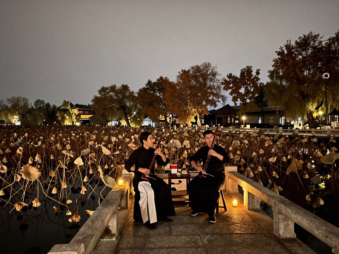 Erhu Duo Performing on Bridge Over Lotus Pond at Night in on a festival main stage in Lanzhou