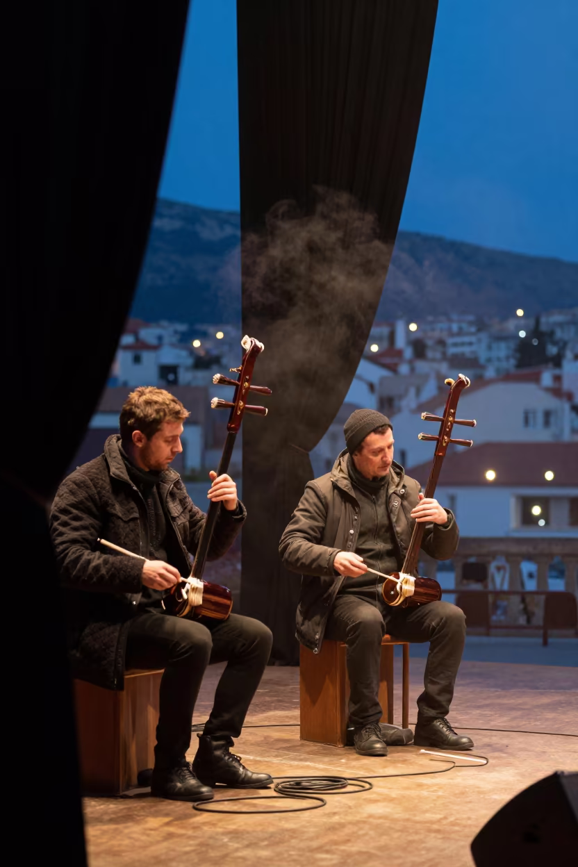 Erhu Duo Performing on Podgorica Stage in on a dimly lit stage in Podgorica