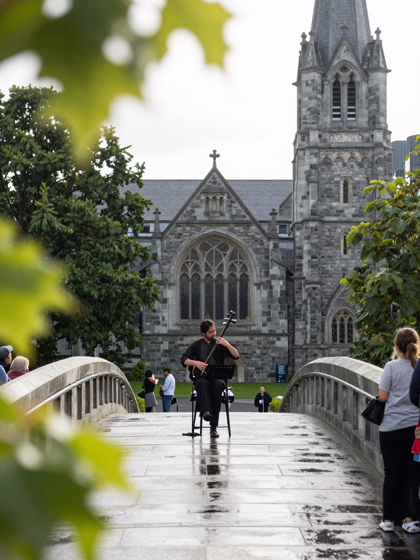 Erhu Player on Christchurch Bridge in Summer Drizzle in at a jazz club in Christchurch