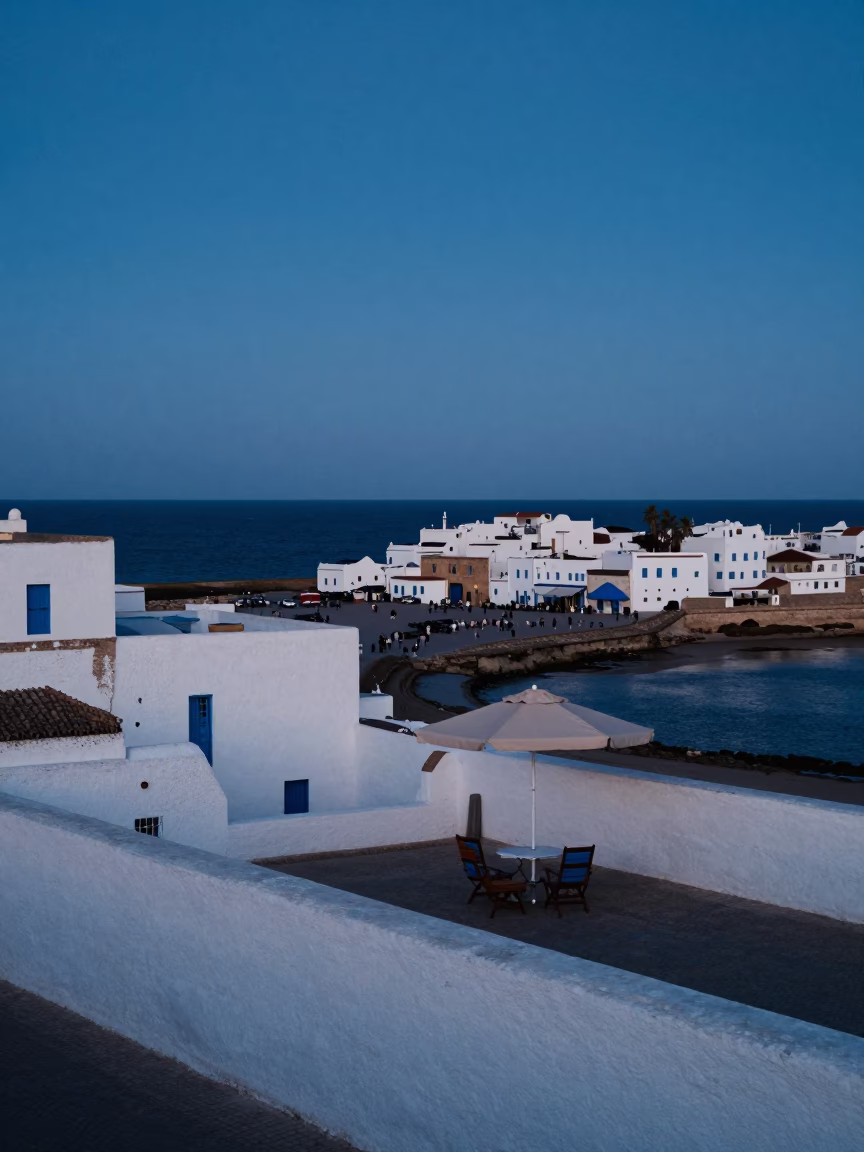 Essaouira Morocco Blue Hour Harbor Scene with Umbrella Stand and Coastal Life in in Essaouira, Morocco