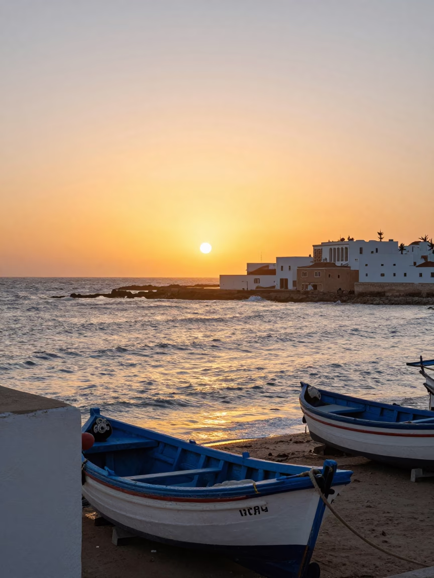 Essaouira Morocco coastal sunset view with fishing boats and blue painted walls in in Essaouira, Morocco
