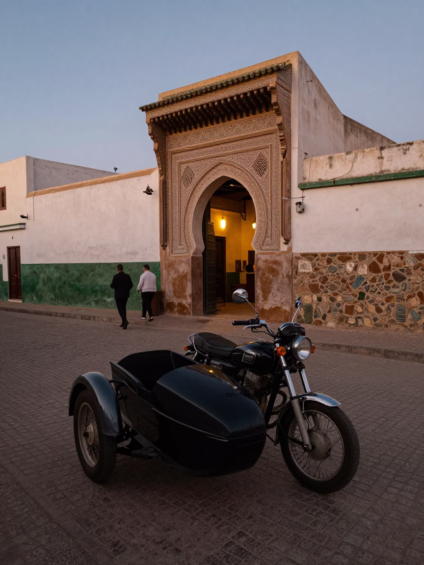 Essaouira Morocco Early Evening Street Scene with Vintage Motorcycle and Local Interaction in in Essaouira, Morocco