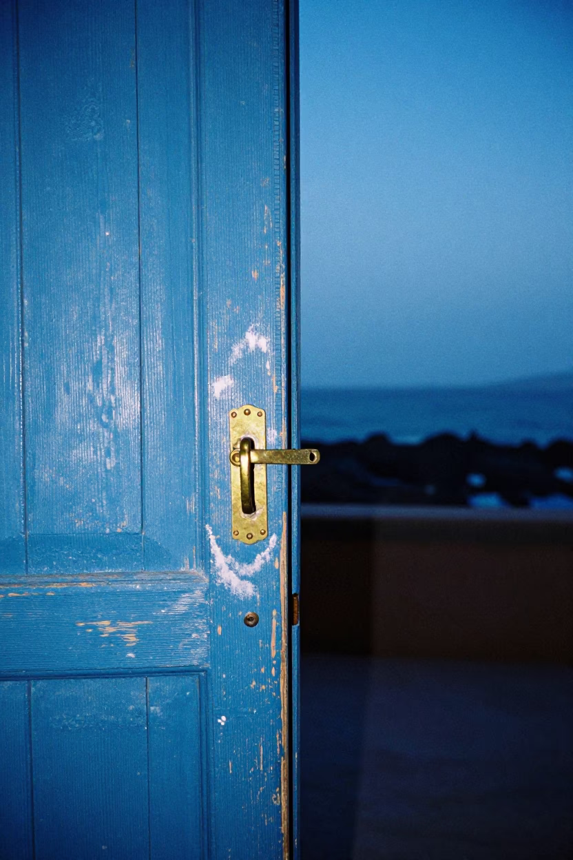 Essaouira Morocco Evening Blue Hour Wooden Door Latch and Coastal Street Scene in in Essaouira, Morocco