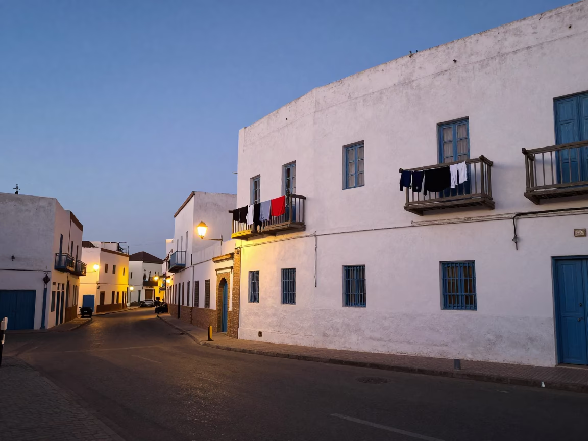 Essaouira Morocco Evening Street Scene with Peg Rails and City Lights Glowing in in Essaouira, Morocco