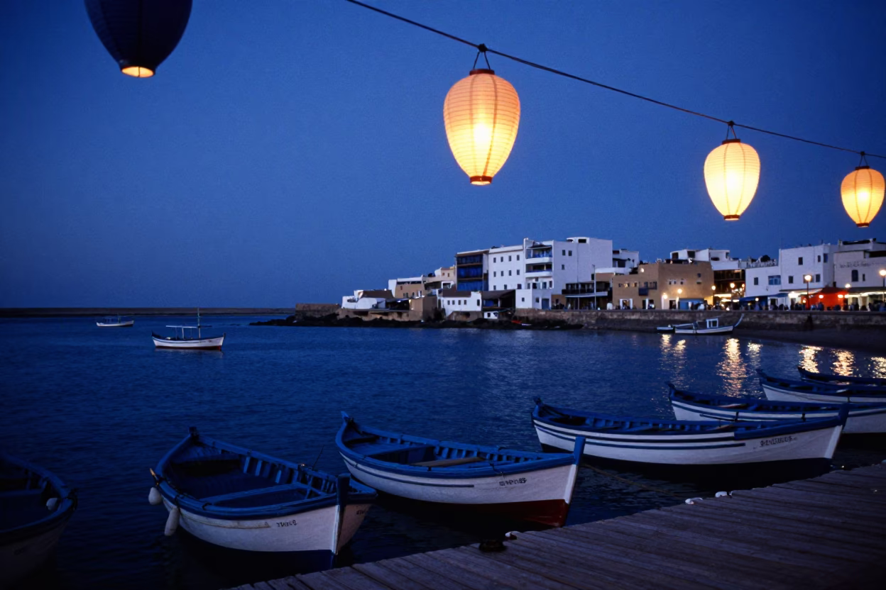 Essaouira Morocco indigo twilight harbor scene with paper lanterns and fishing boats in in Essaouira, Morocco