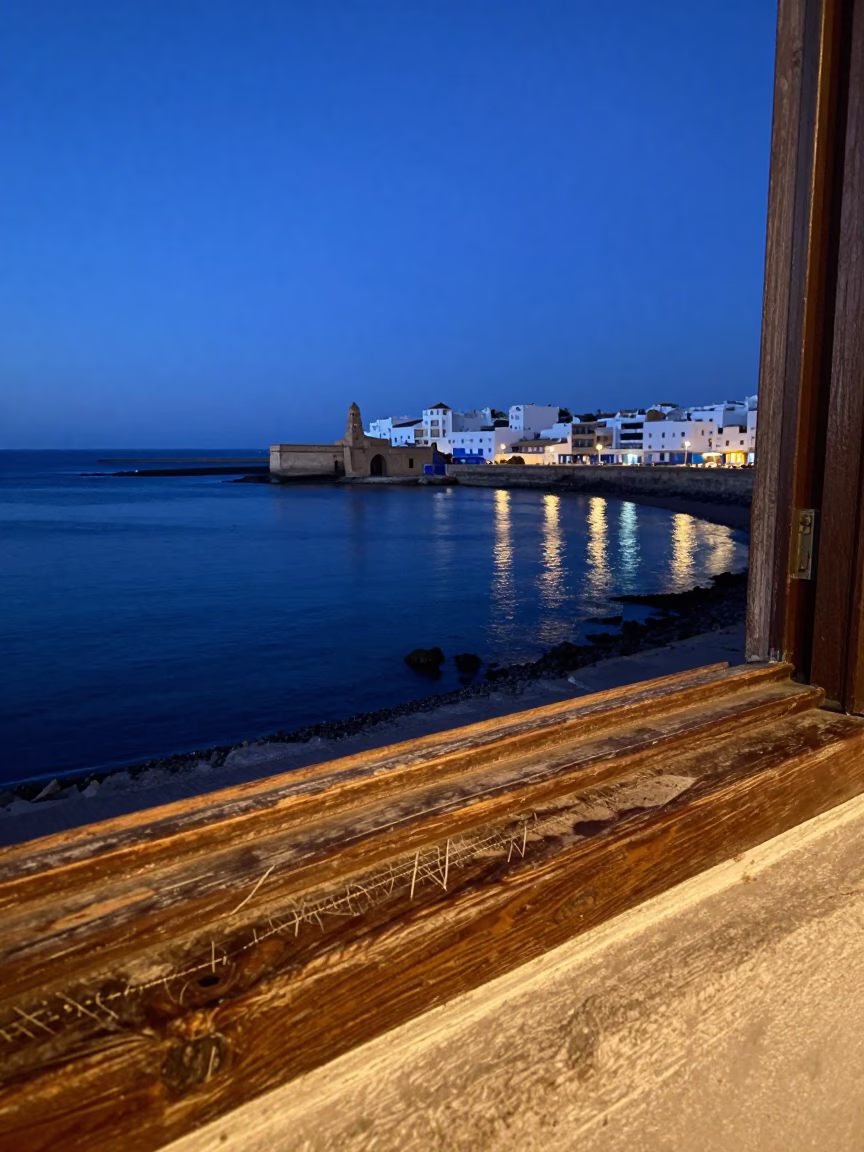Essaouira Morocco Indigo Twilight Harbor Scene with Wooden Sill Scratches in in Essaouira, Morocco