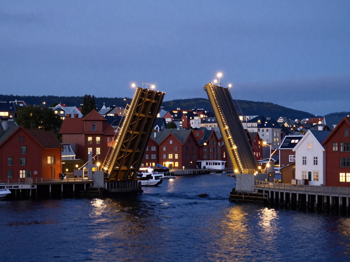 Evening Bergen Norway Drawbridge Lifting Over Dark Tidal Channel With City Lights in in Bergen, Norway