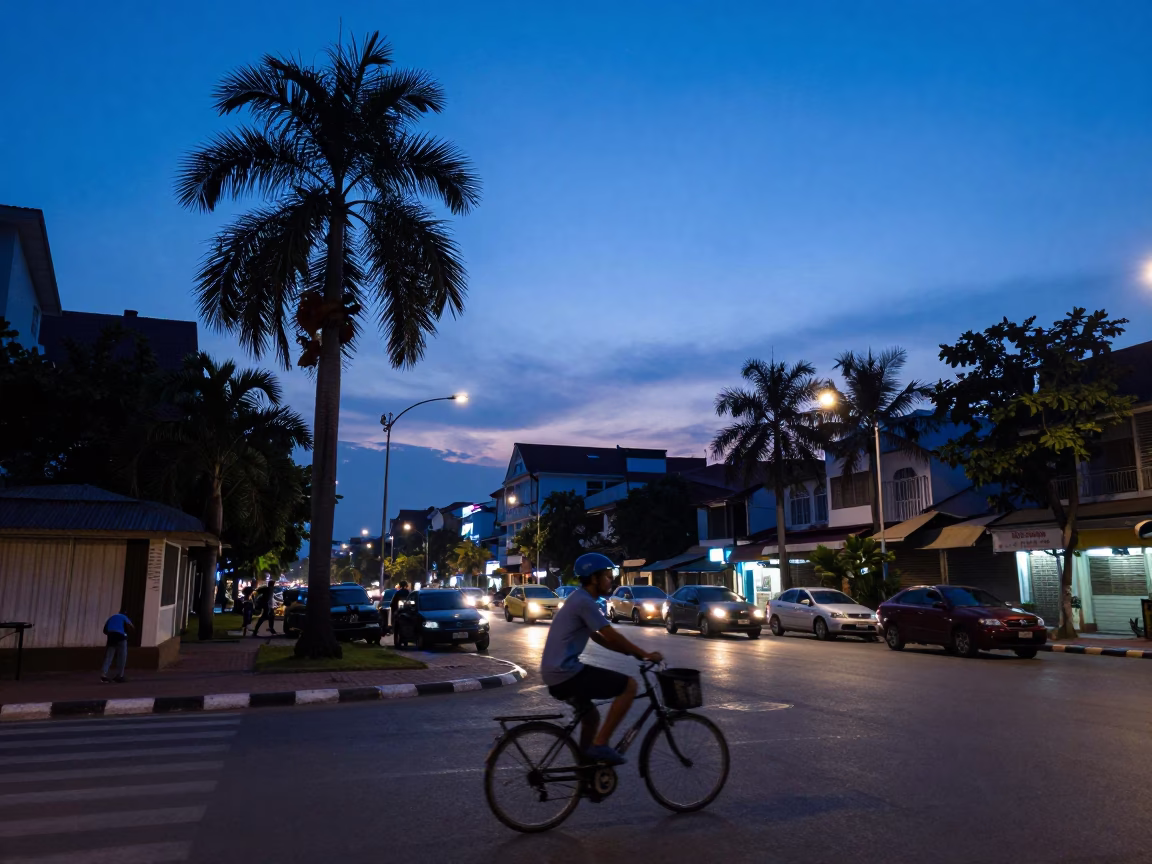 Evening Blue Hour Street Scene in Phnom Penh Cambodia with Cyclist in in Phnom Penh, Cambodia