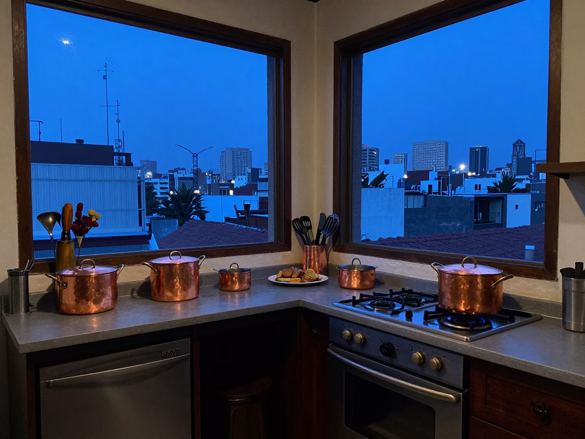 Evening Blue Light in Mexico City Kitchen with Copper Pots and Workbench in in Mexico City, Mexico