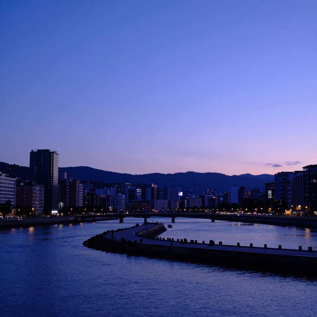 Evening Harbor View in Bilbao Spain with Blue Hour Sky and Breakwater in in Bilbao, Spain