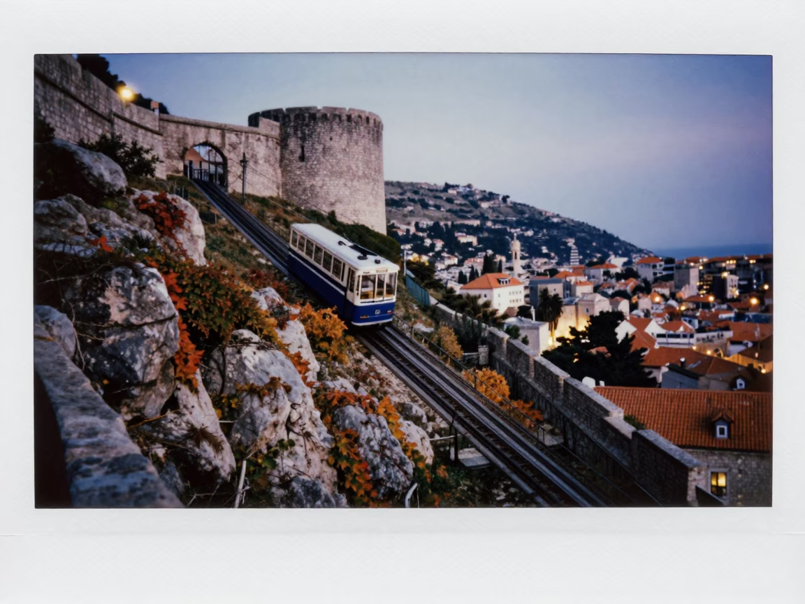 Evening in Dubrovnik Croatia with Old Town Walls and Funicular Railway Amidst City Lights in in Dubrovnik, Croatia
