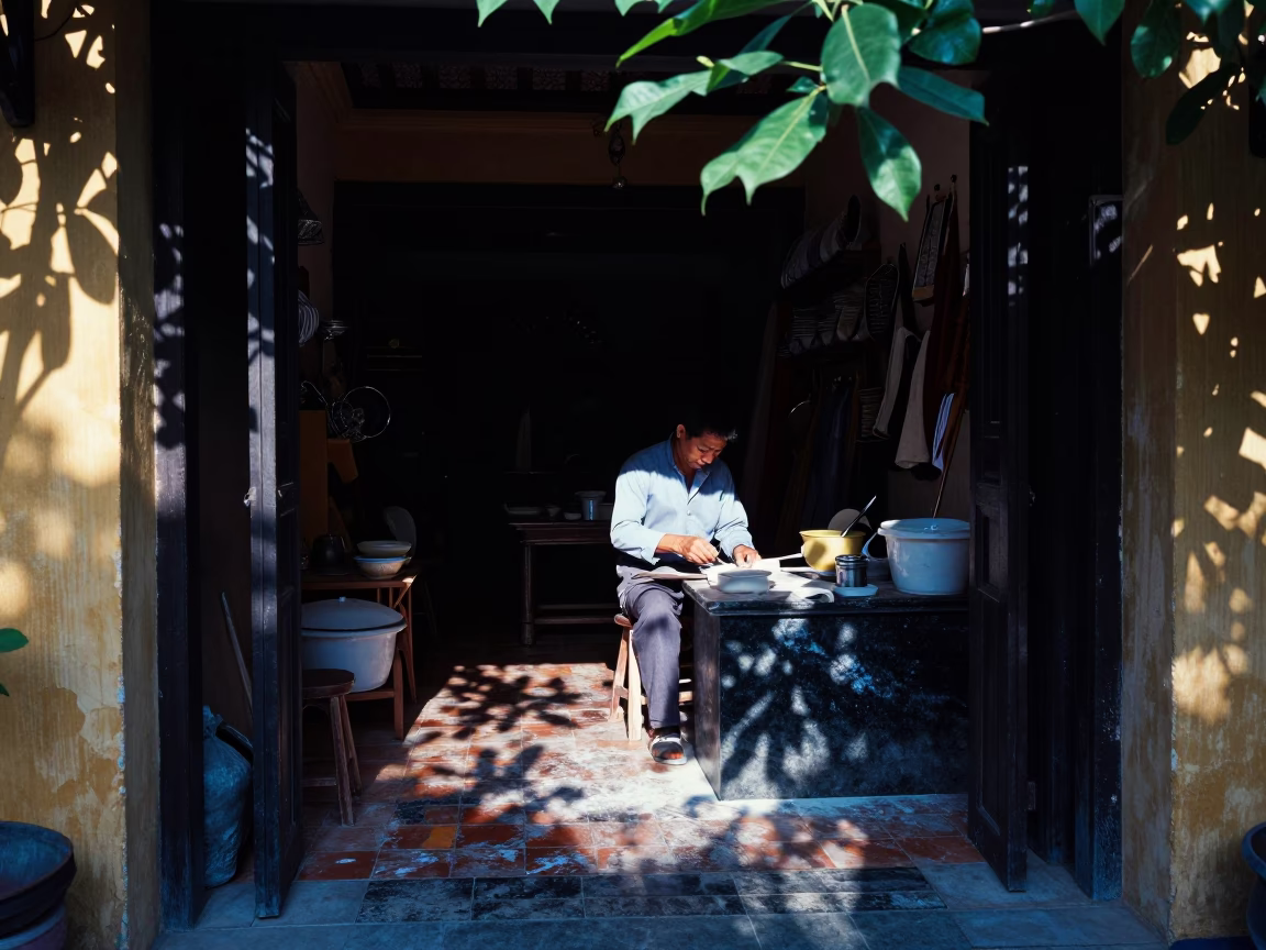 Evening light in Hoi An shop with flour dust and leaf shadows in in Hoi An, Vietnam