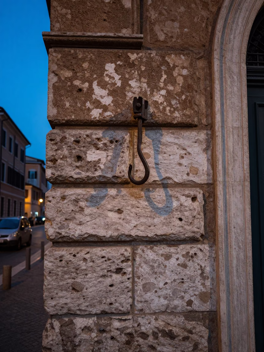 Evening Light in Rome Street Corner with Iron Hook and Marble Detail in in Rome, Italy