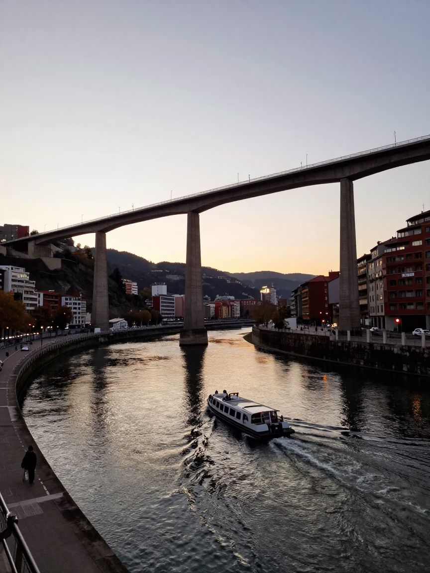 Evening Light on Bilbao Viaduct and River Scene with Local Life in in Bilbao, Spain
