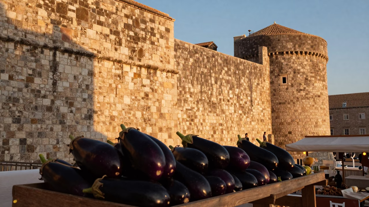 Evening Light on Dubrovnik Stone Walls with Eggplants at Market Stall in in Dubrovnik, Croatia