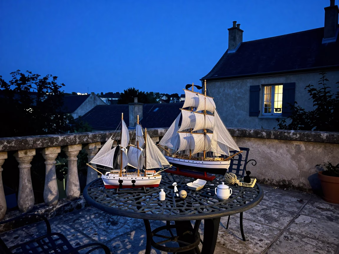 Evening Light on Nice France Terrace with Model Ship and Vintage Plate in in Nice, France