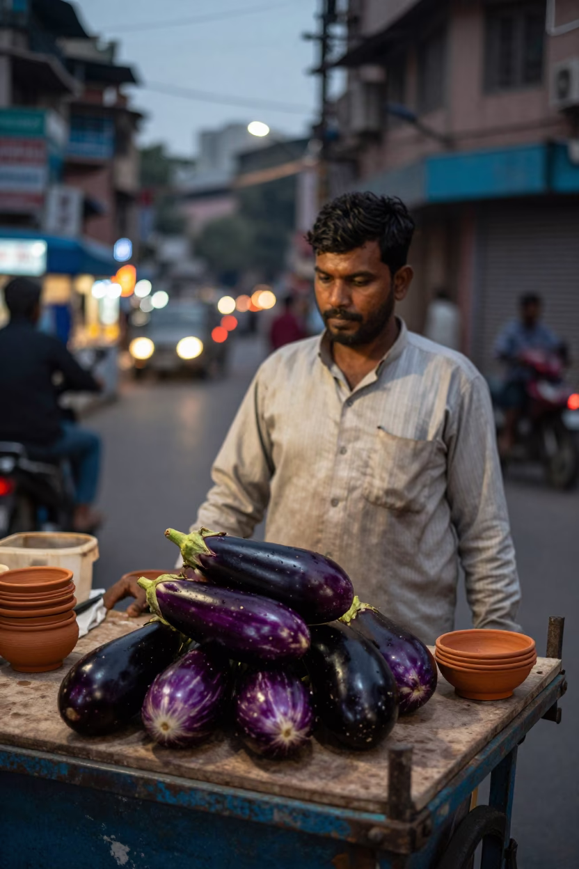 Evening Street Food Vendor in Delhi India with Eggplants and Clay Bowls in in Delhi, India