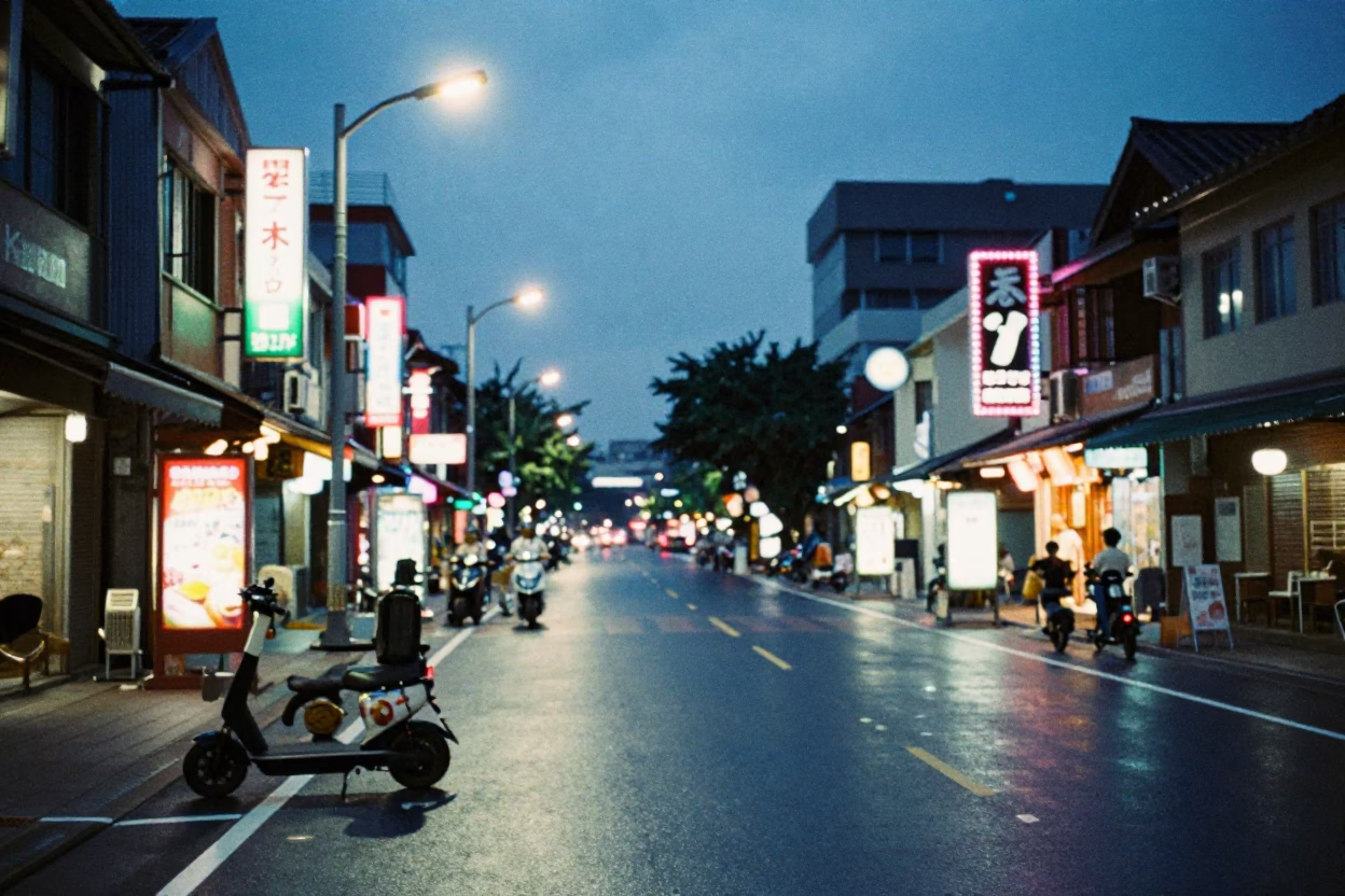 Evening Street Life in Tainan Taiwan with Electric Scooters and Neon Signs in in Tainan, Taiwan
