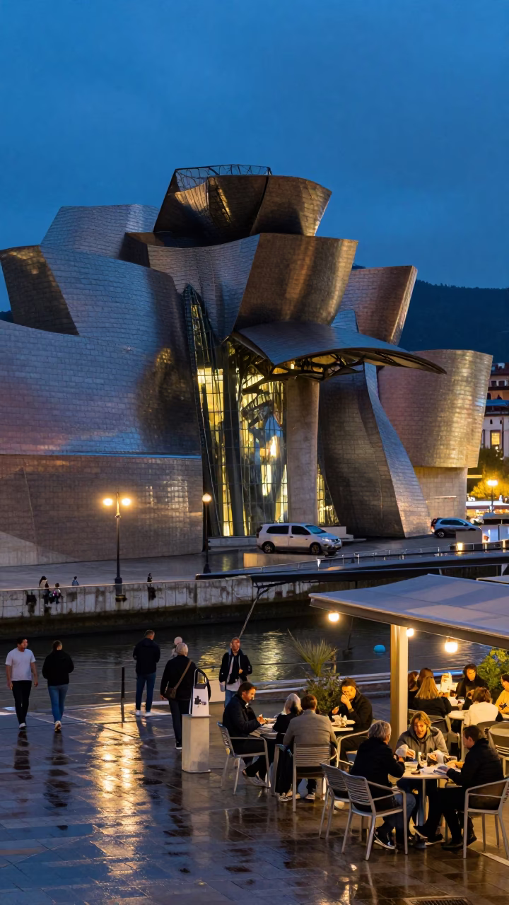 Evening Street Scene in Bilbao Spain with Guggenheim Museum Architecture and Local Diners in in Bilbao, Spain