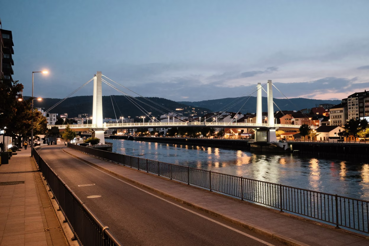 Evening Street Scene in Bilbao Spain with Suspension Bridge and Local Shop in in Bilbao, Spain