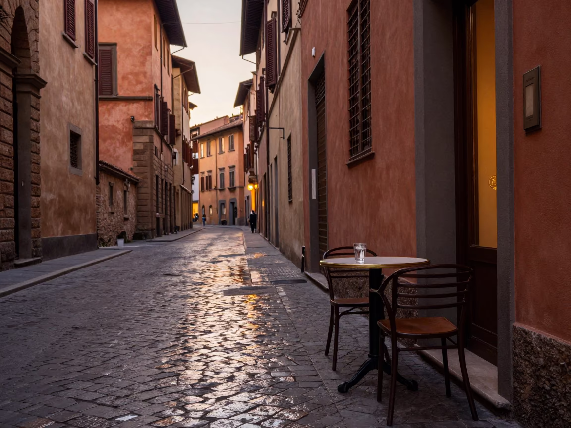 Evening Street Scene in Bologna Italy with Glass Tumbler on Cafe Table in in Bologna, Italy