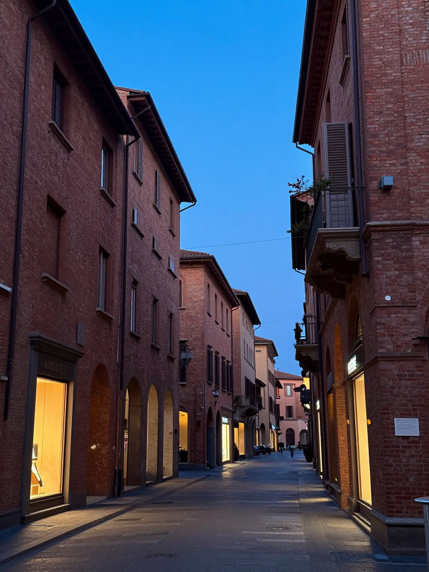 Evening Street Scene in Bologna Italy with Red Brick Architecture and Blue Twilight in in Bologna, Italy