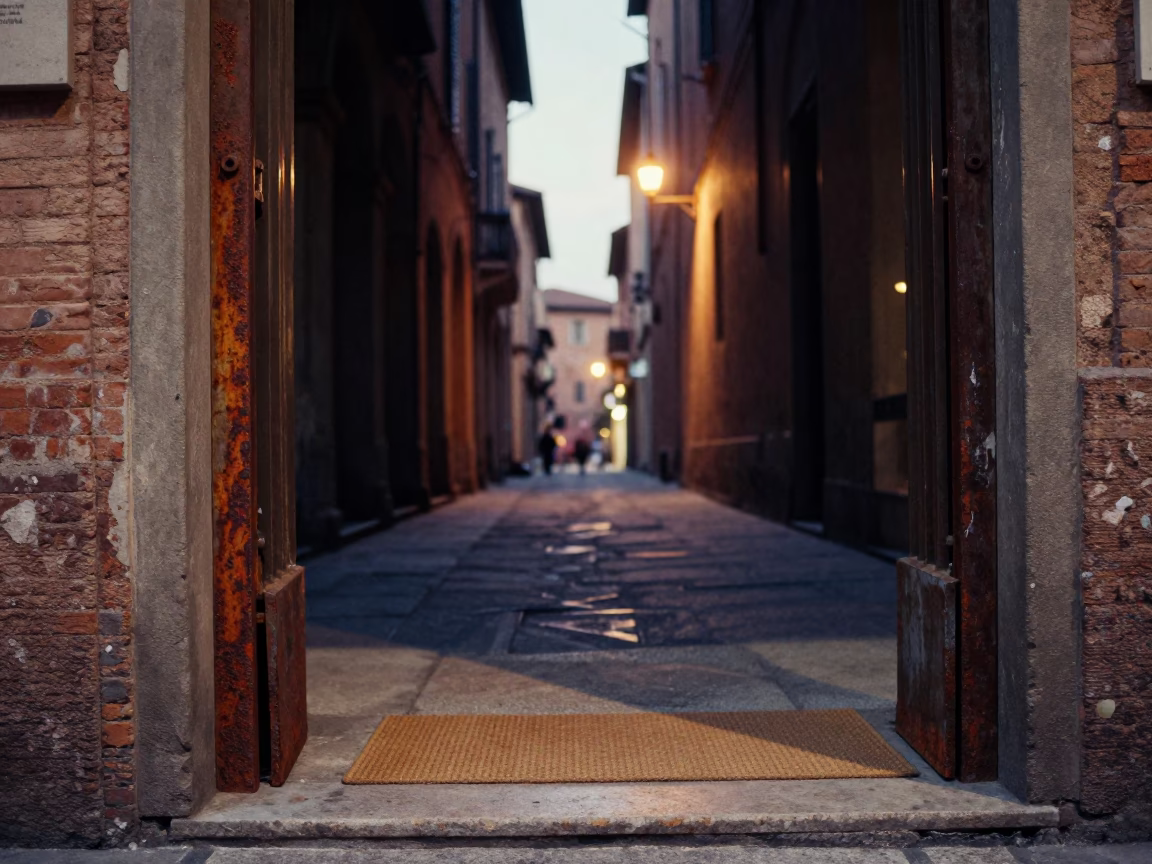 Evening Street Scene in Bologna Italy with Rusty Doorframe and Doormat in in Bologna, Italy