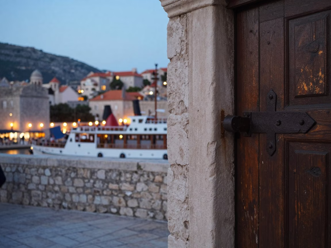 Evening Street Scene in Dubrovnik Croatia with Iron Deadbolt and Steamship in Harbor in in Dubrovnik, Croatia