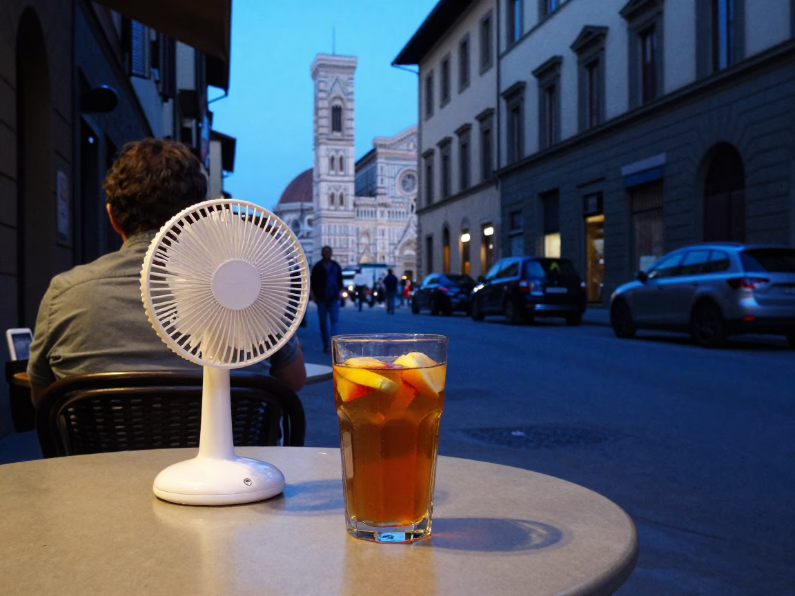 Evening Street Scene in Florence Italy with Glass of Kombucha and Vintage Table Fan in in Florence, Italy