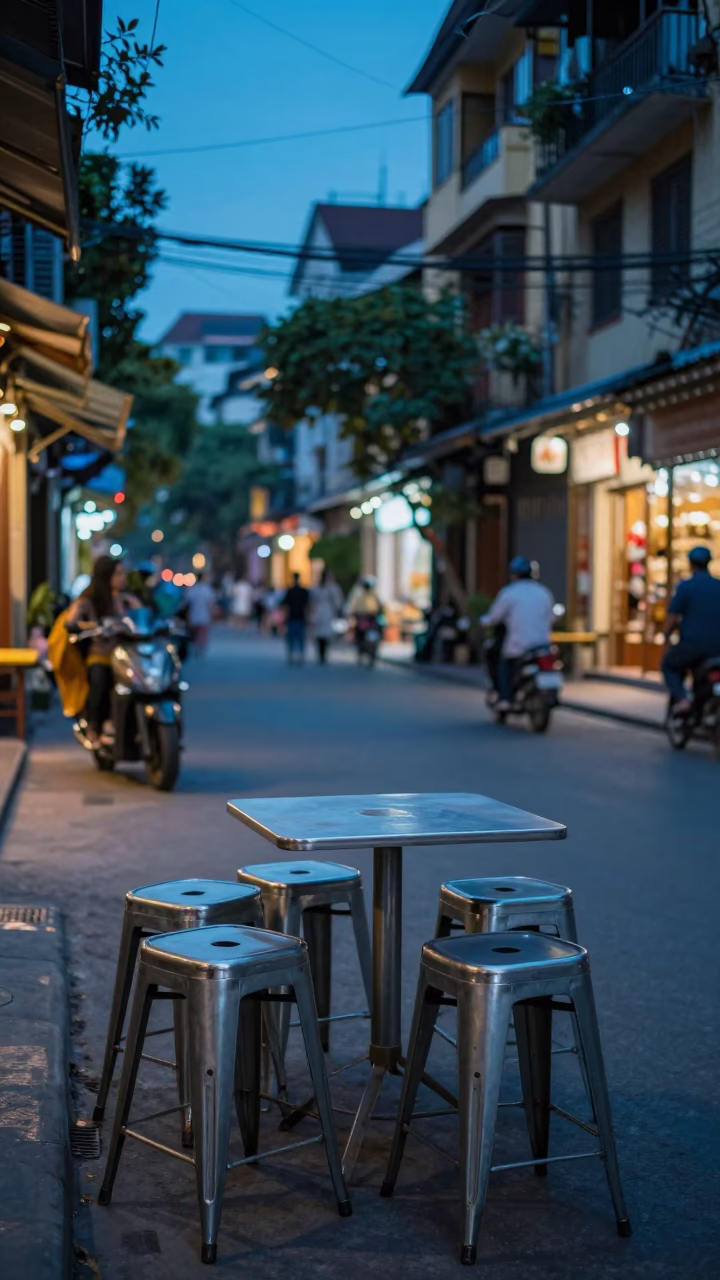 Evening Street Scene in Hanoi Vietnam with Metal Stools and Urban Life in in Hanoi, Vietnam