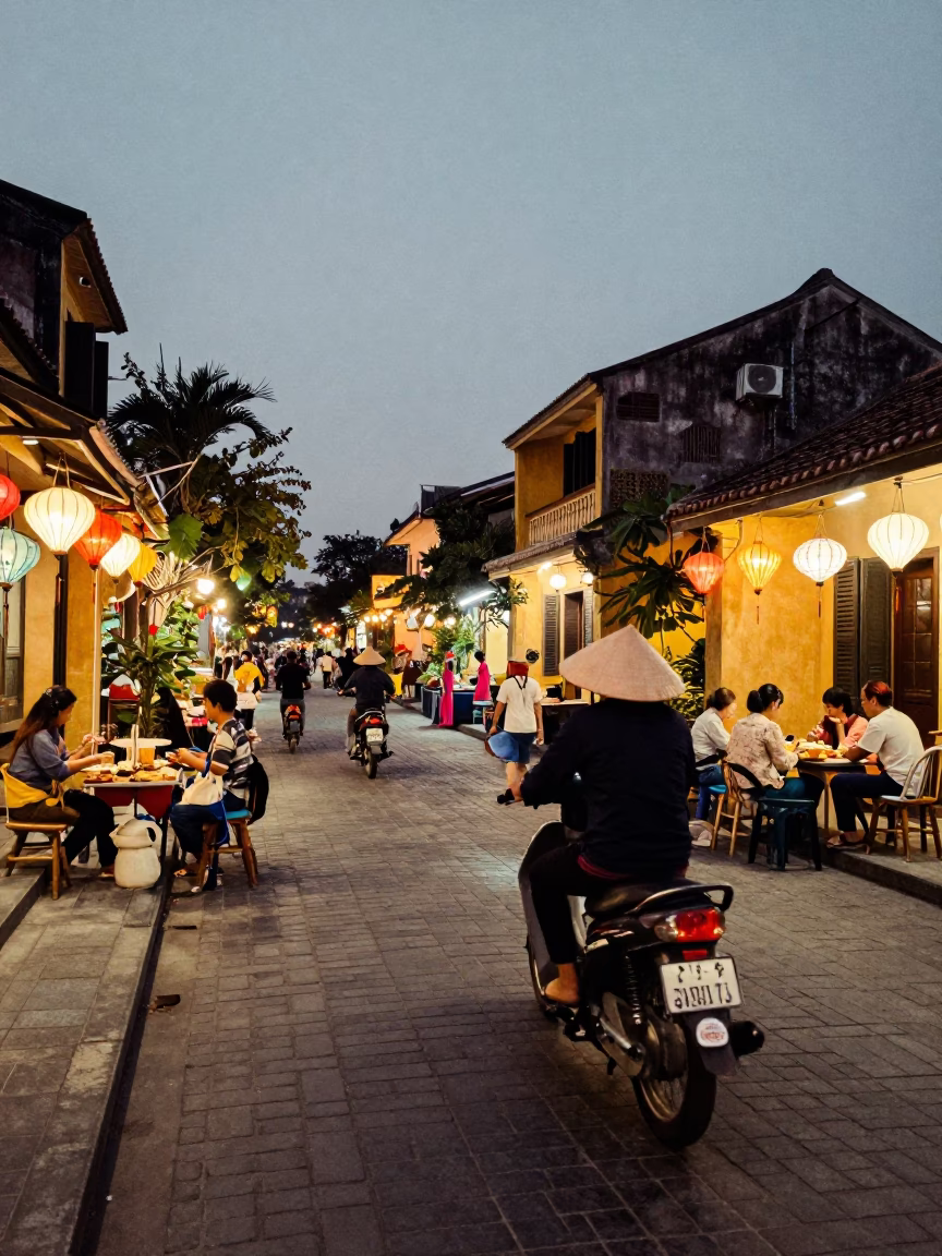 Evening street scene in Hoi An Vietnam with lanterns and local vendors in in Hoi An, Vietnam